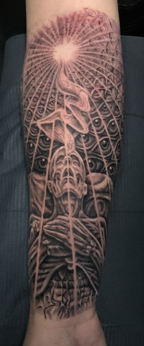 Surreal black and gray forearm tattoo of a spiritual figure with radiating all-seeing eyes and divine light beam, geometric illustrative style by Zack Ross, Austin Texas tattoo artist in Kyle TX