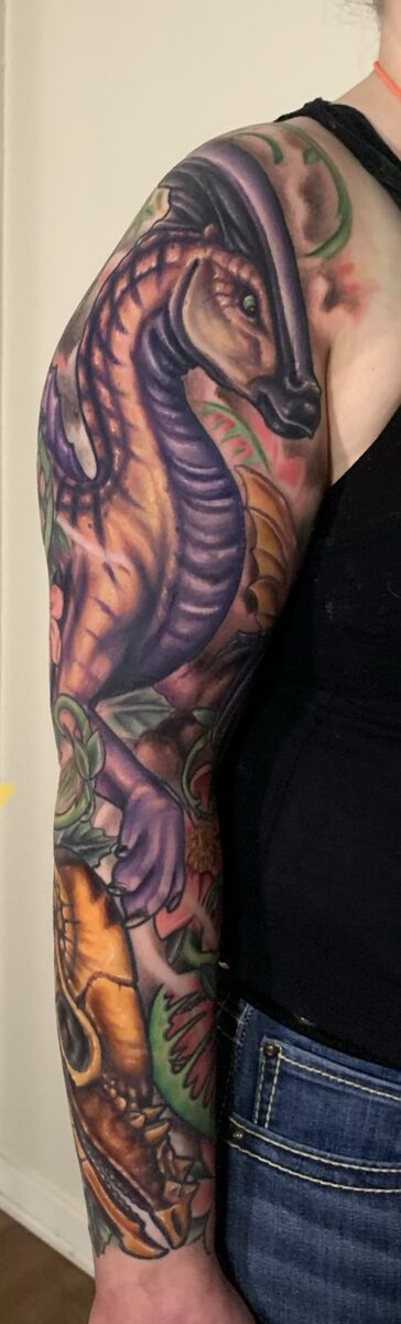 Color sleeve section by Zack Ross, bold saturated color tattoo with detailed illustrative shading, custom tattoo artist Kyle TX near Austin Texas